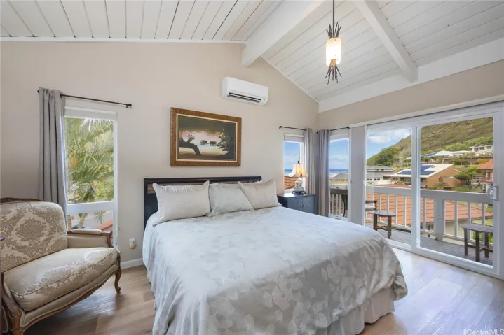 The primary suite boasts ocean views and high ceilings.