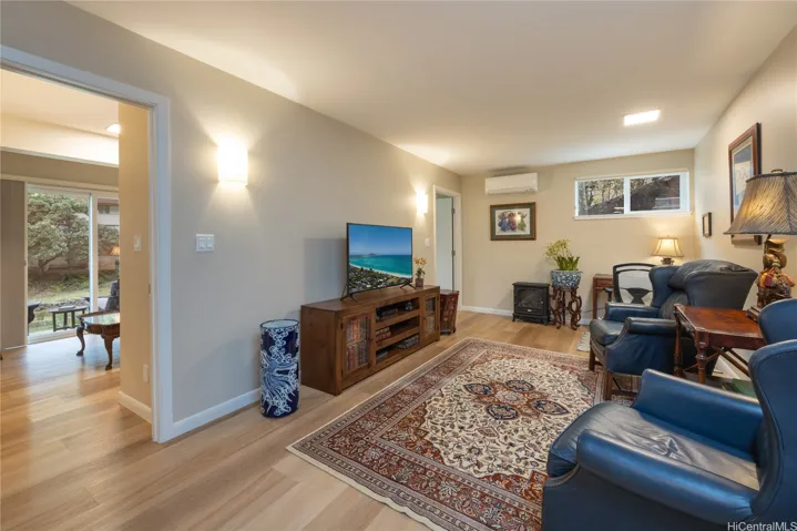 The home's tri-level includes a second living-room adjacent to two additional bedrooms.