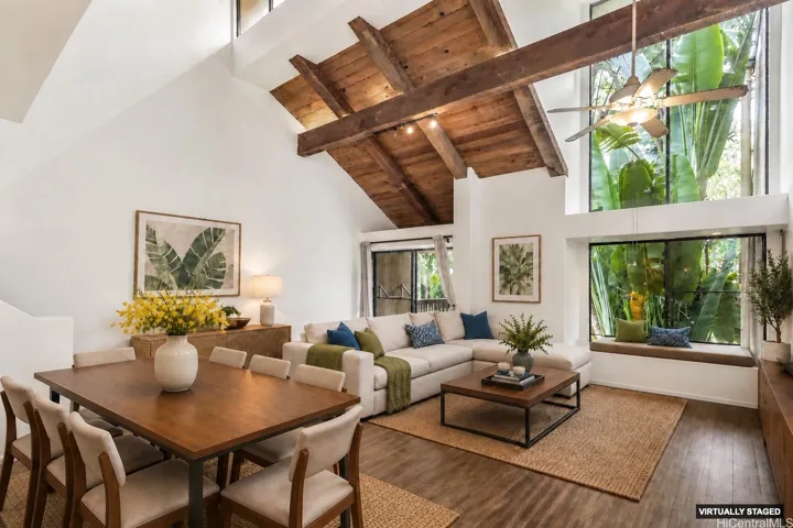 A reading nook tucked beneath expansive windows