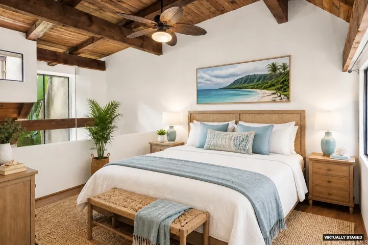 Upstairs primary loft bedroom with bamboo flooring and high ceilings