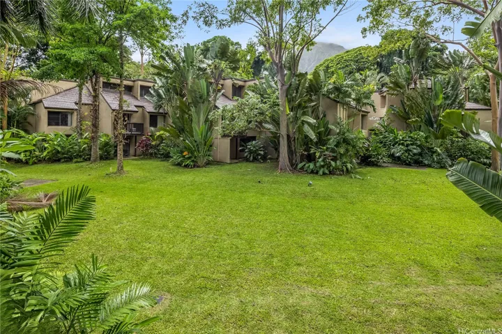 Resort-like grounds with lush, tropical flora and walking paths throughout