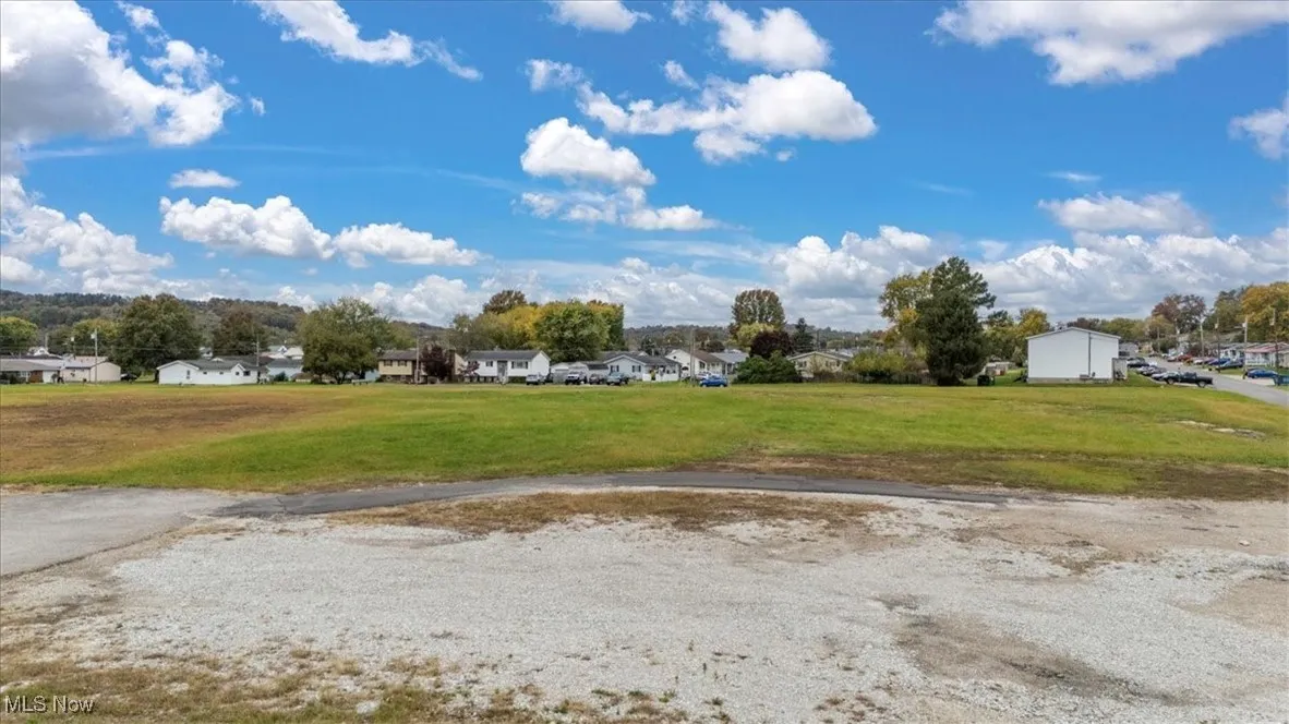 View of home's community featuring a residential view and a yard