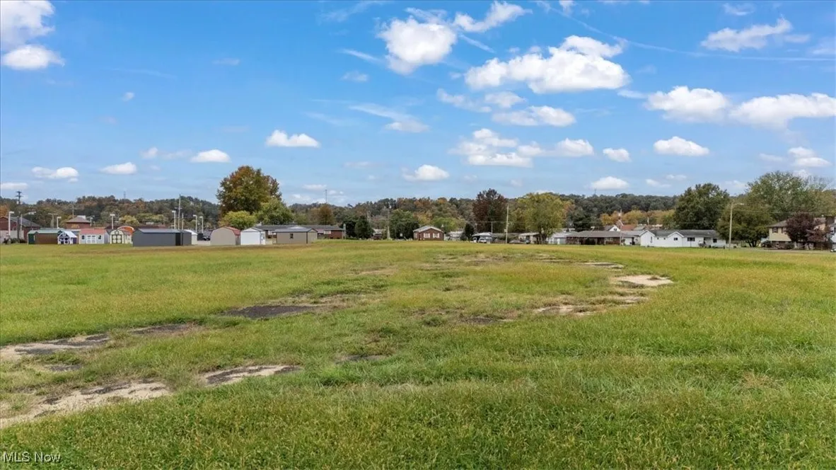 View of grassy yard with a residential view