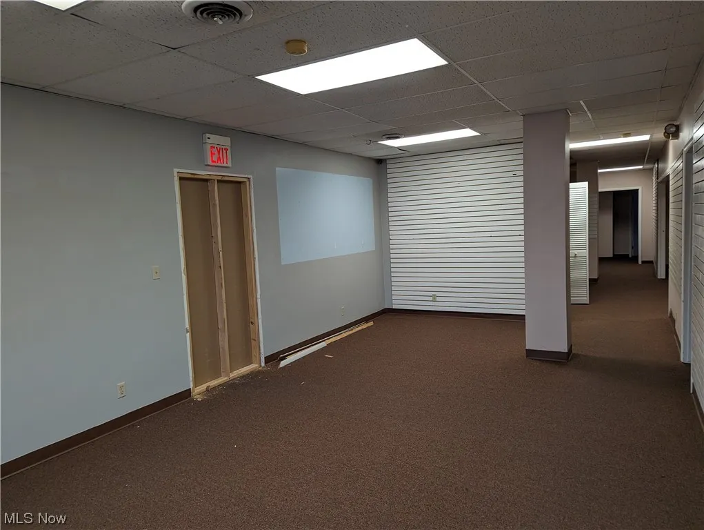 Different angle of this front room, yes I believe the wall is now fully enclosed where the opening was in construction.  This front room does have a window to the parking area out front.