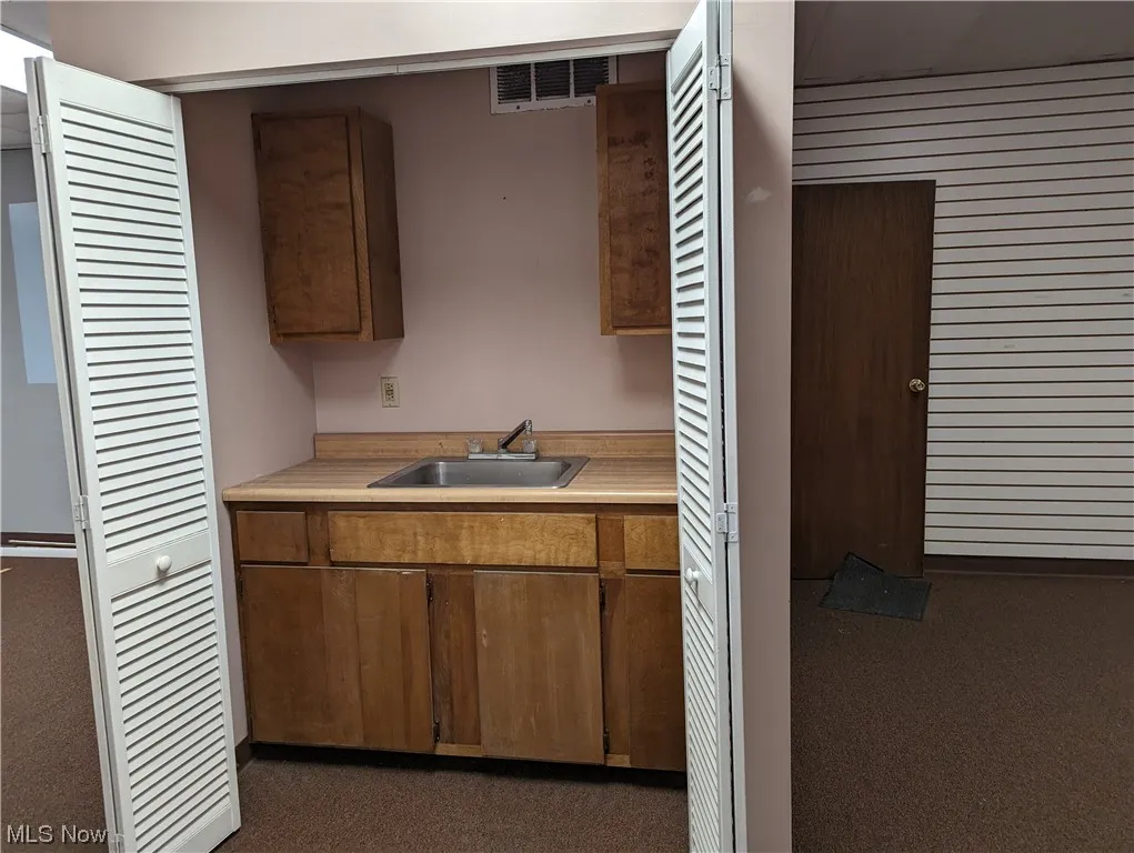 This kitchenette closet is in between the front and middle areas.