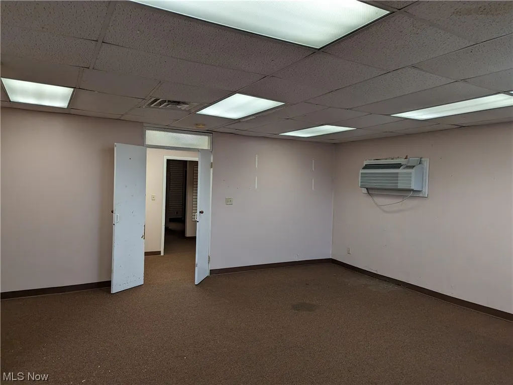 This large rear room does have a door into it.