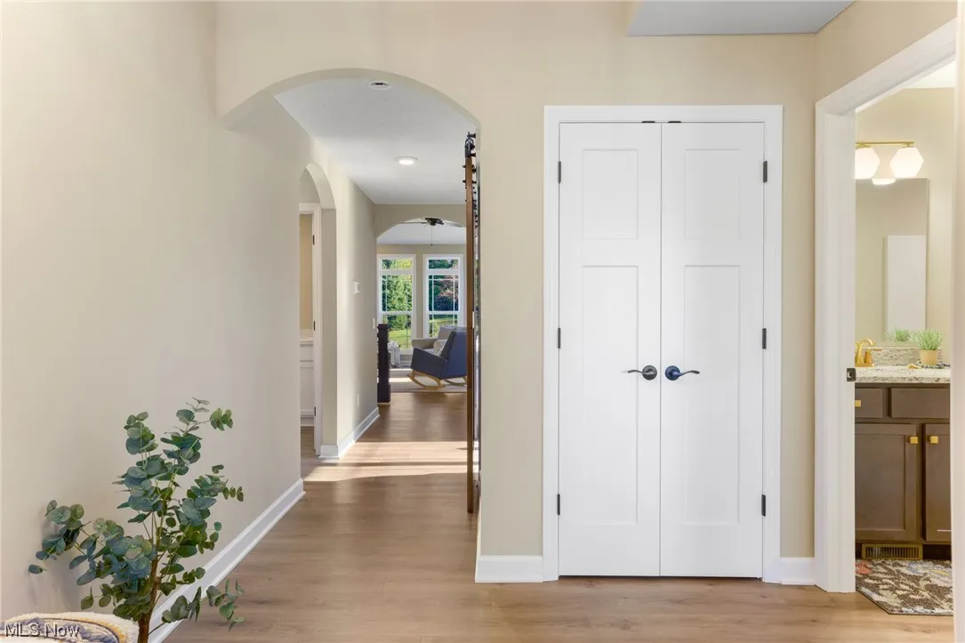 Hallway with light hardwood floors