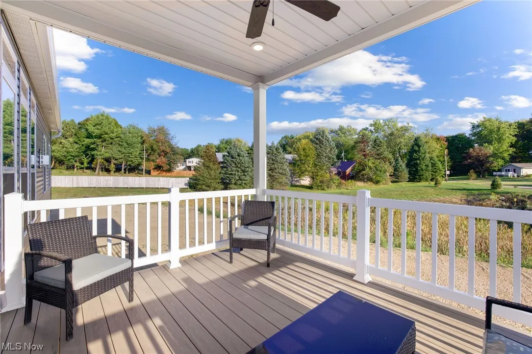 Wooden deck featuring ceiling fan