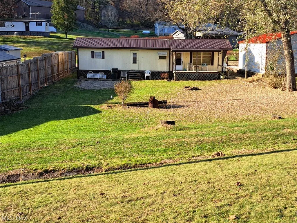 Front of Home and part of 2nd vacant parcel