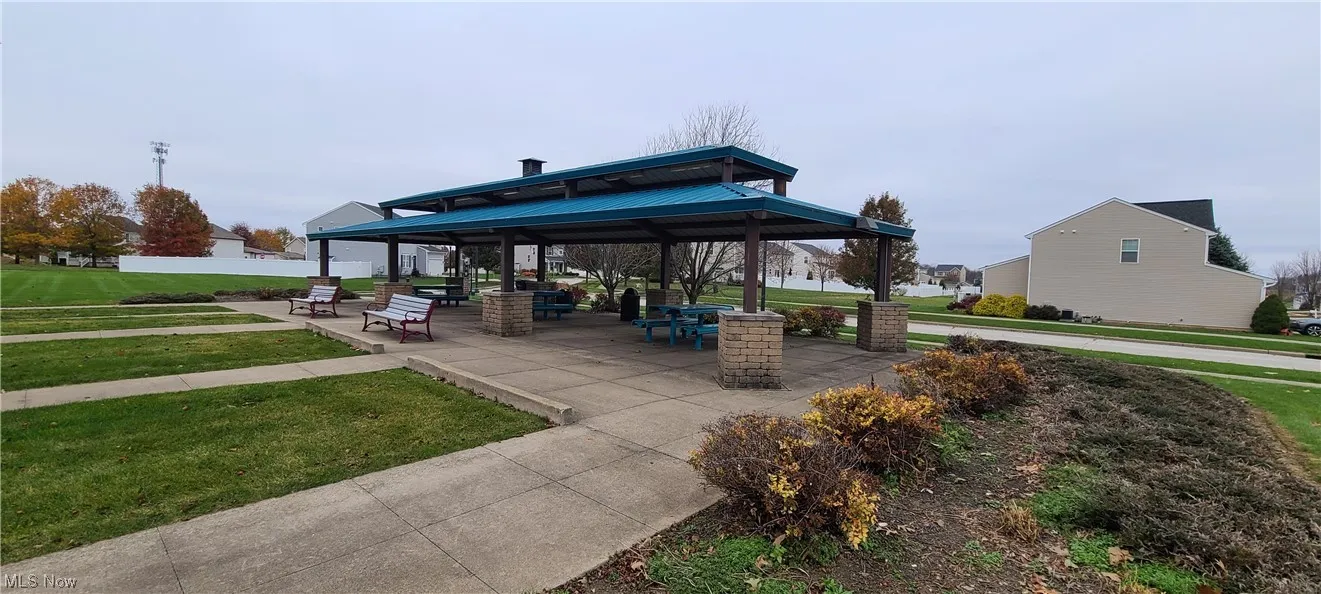 Surrounding community with a gazebo and a lawn