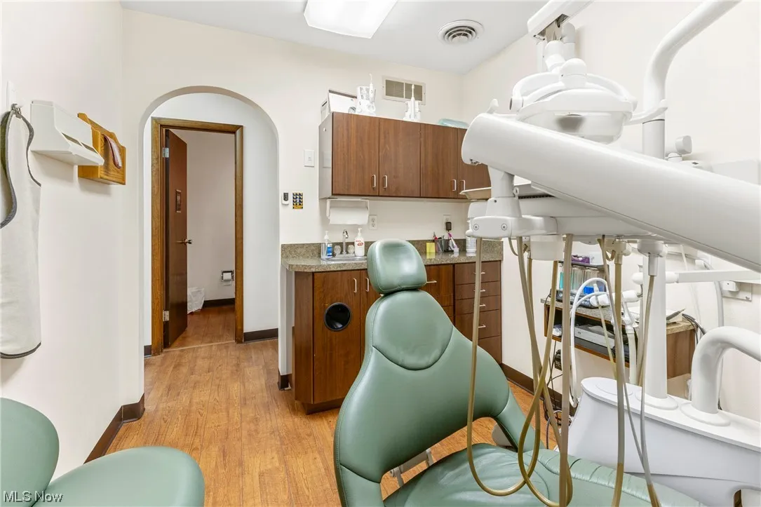 Treatment room light hardwood / wood-style flooring