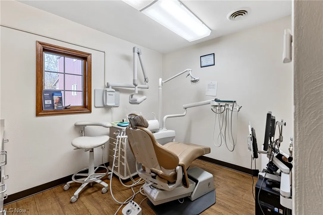 Workout area featuring hardwood / wood-style flooring