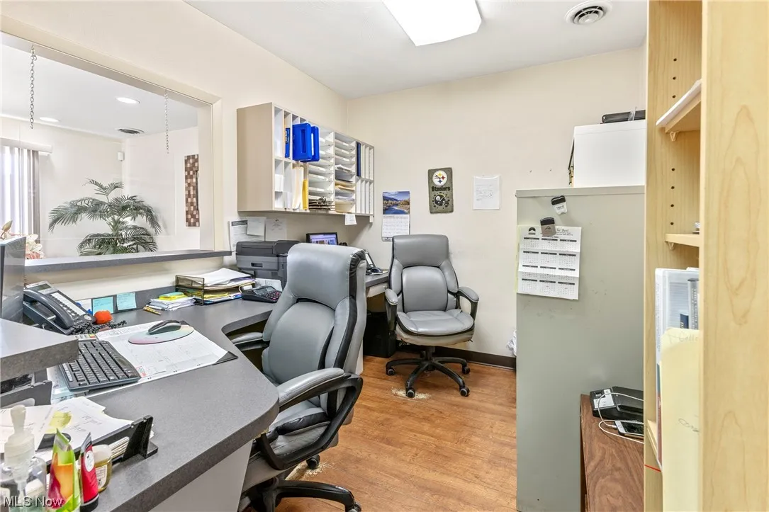  office featuring light wood-type flooring
