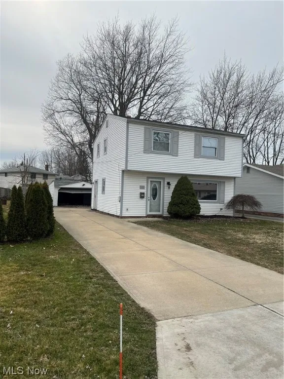 View of front of property with a front lawn