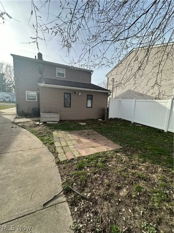 Back of property with a patio area