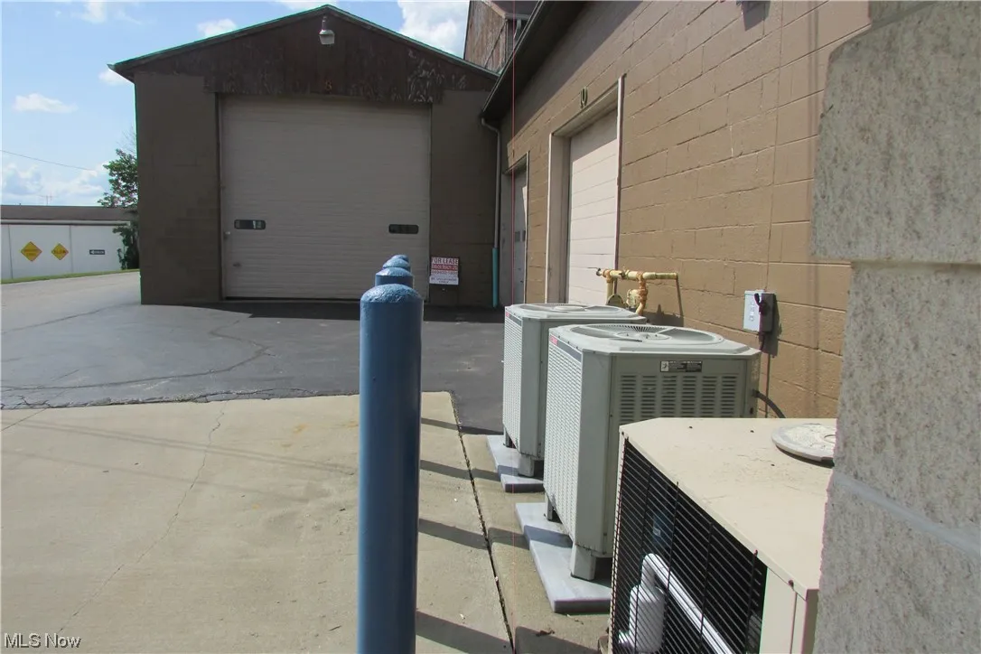 Rent this long bay and the other 2 doors in the pic are the mechanics garage and office also for lease!