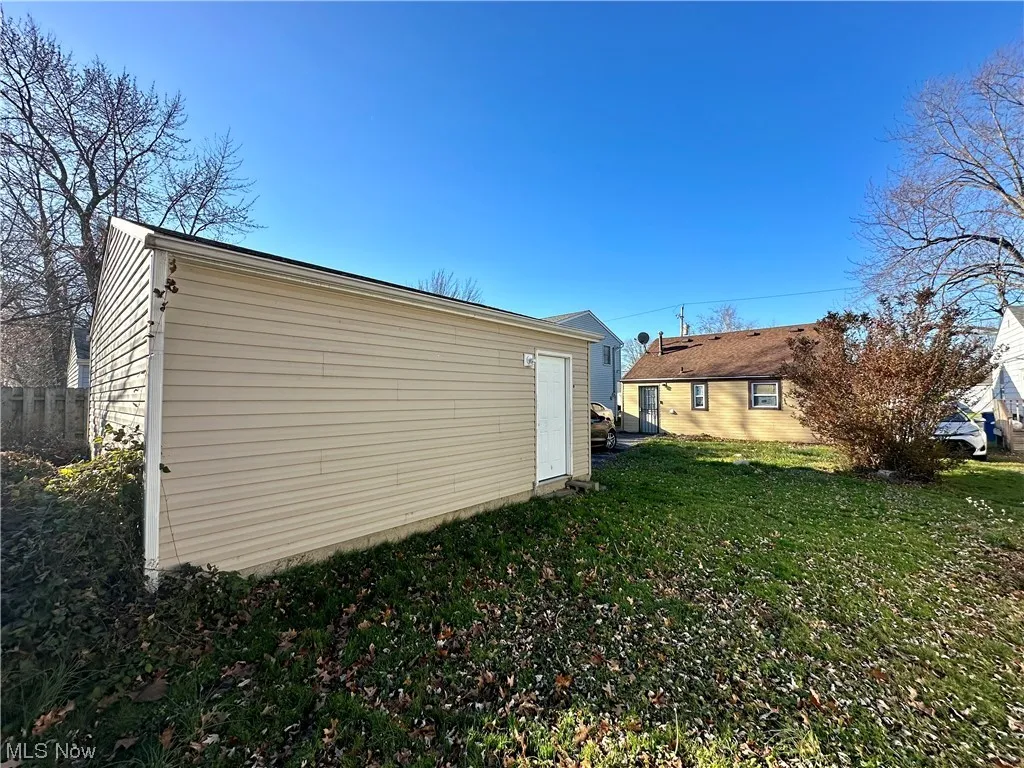 View of property exterior featuring a yard