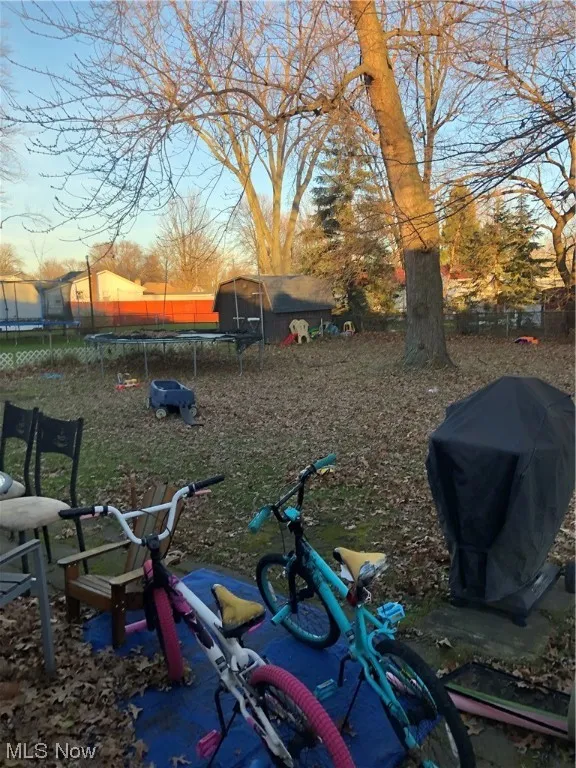 View of yard featuring a trampoline
