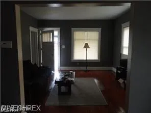 Living room featuring dark hardwood / wood-style floors