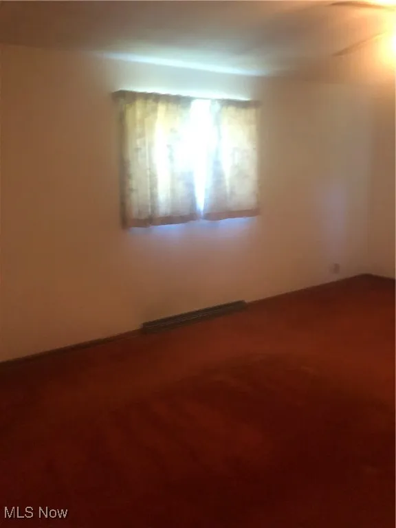 Spare room with carpet floors