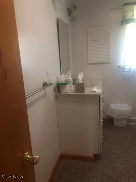 Bathroom with baseboards and vanity
