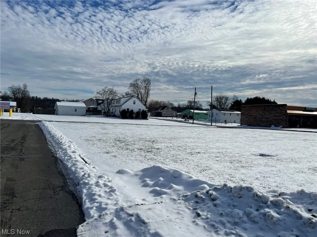 View of yard covered in snow
