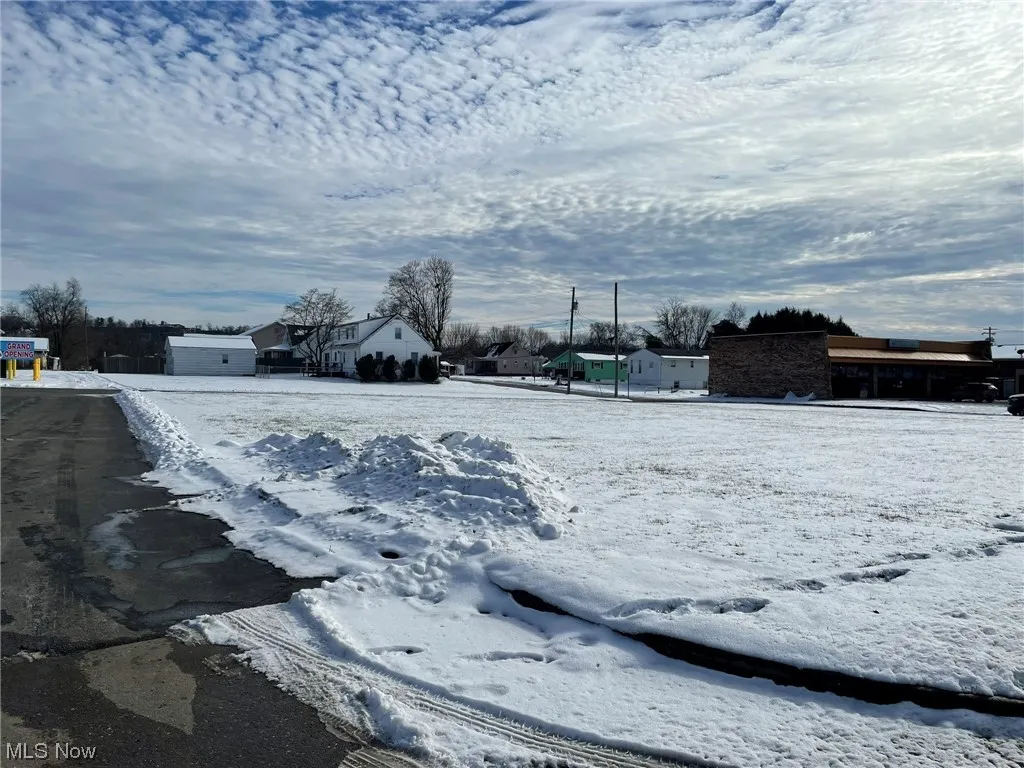 View of yard layered in snow