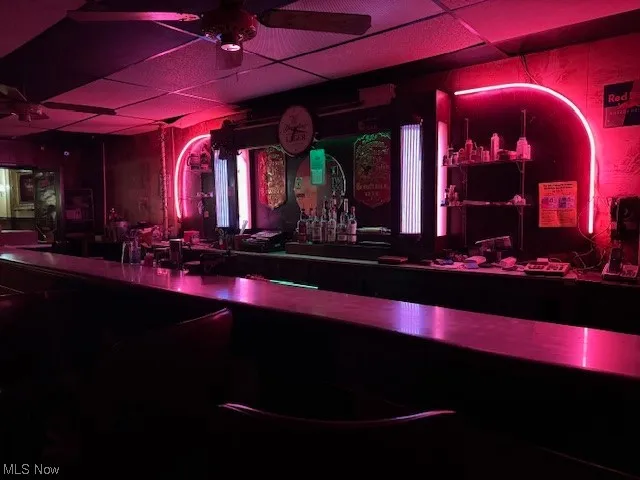 Bar with a drop ceiling and ceiling fan
