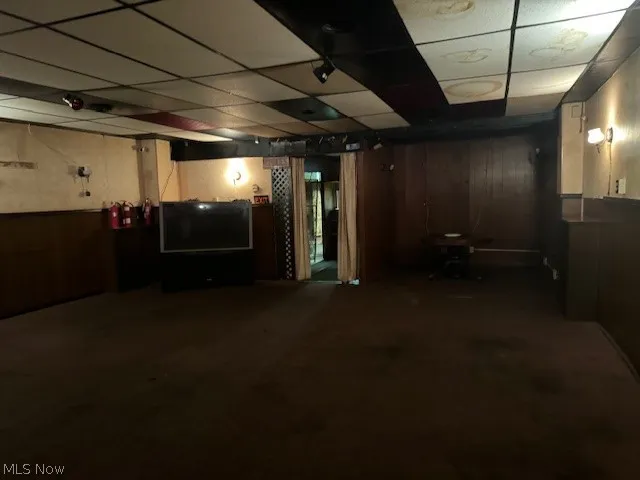 Basement with a paneled ceiling