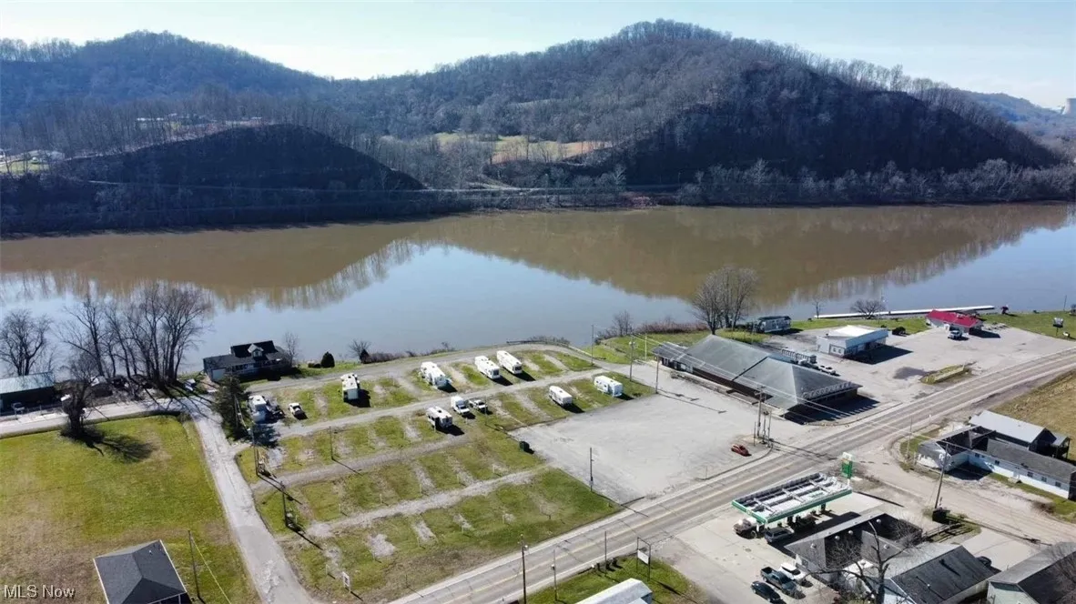 Drone / aerial view featuring a water and mountain view