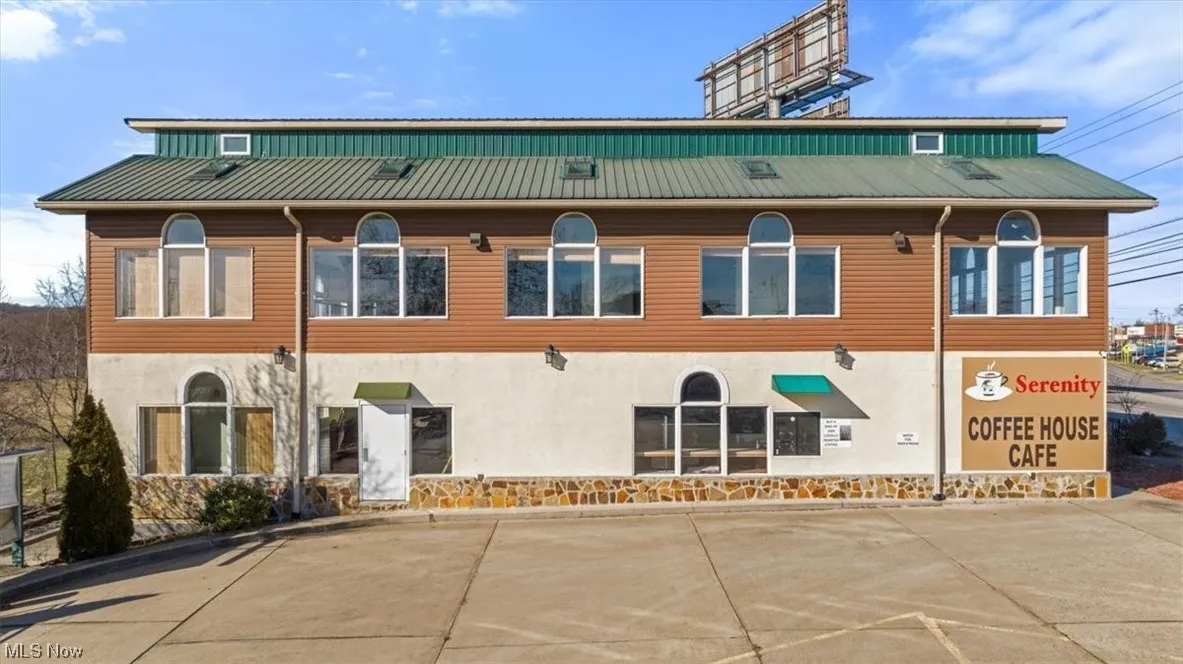 View of building exterior and parking area