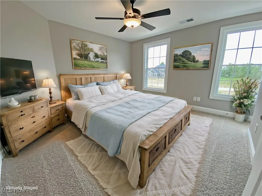 Bedroom featuring light carpet and ceiling fan and Jack n Jill Bath
