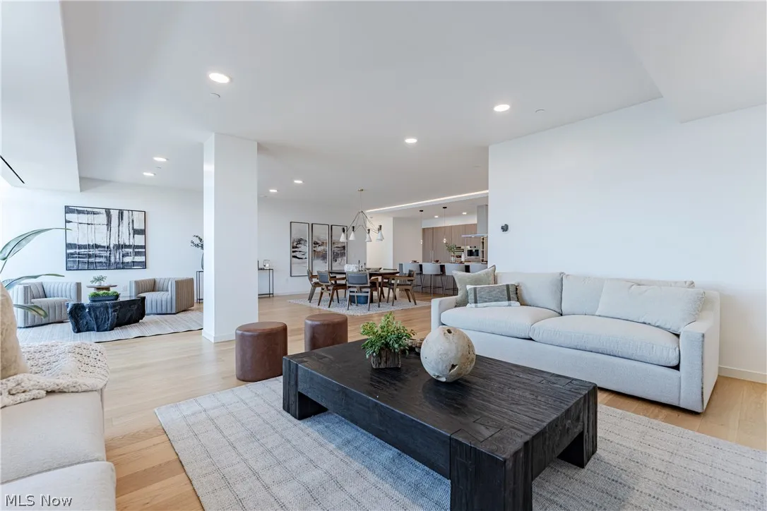 Living room with light hardwood / wood-style flooring