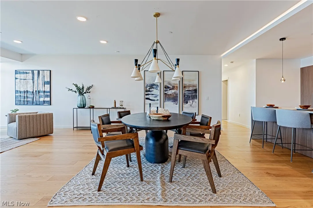 Dining area with light wood-type flooring