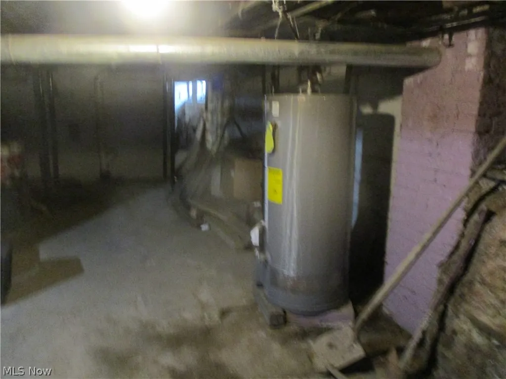 Basement featuring water heater