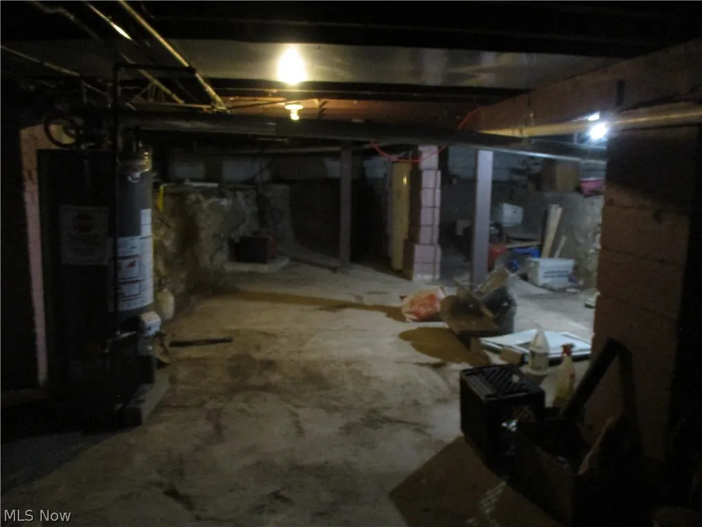 Basement featuring water heater