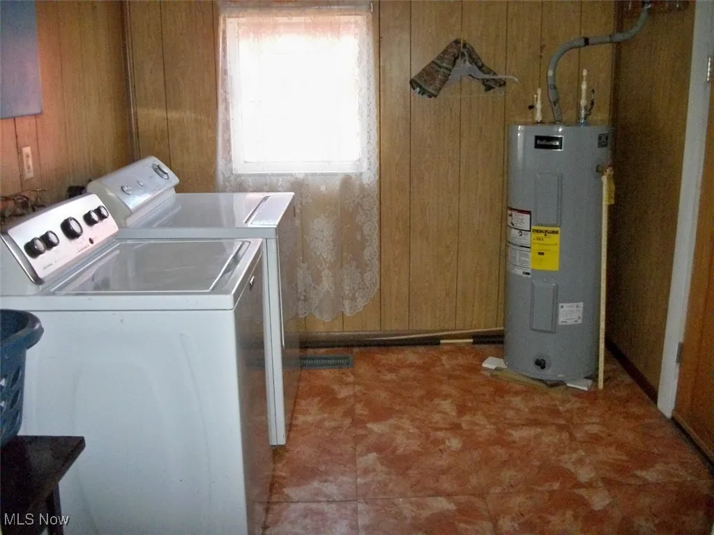 laundry, utility, & Mud room with outside side door.