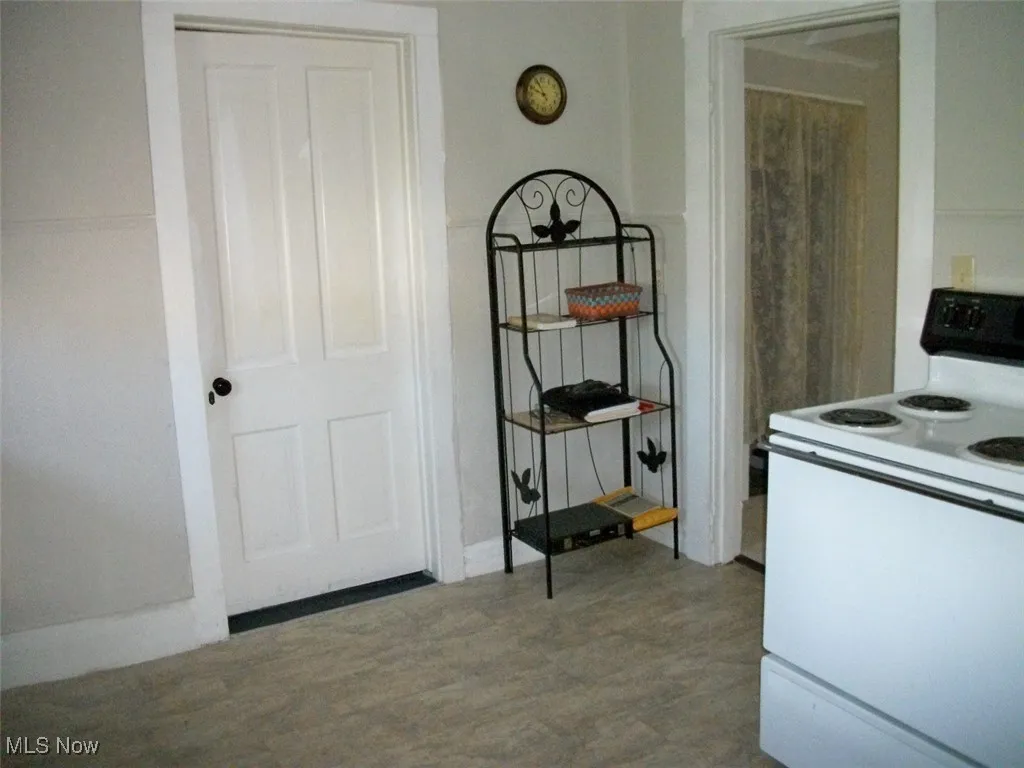 Kitchen featuring white electric range oven