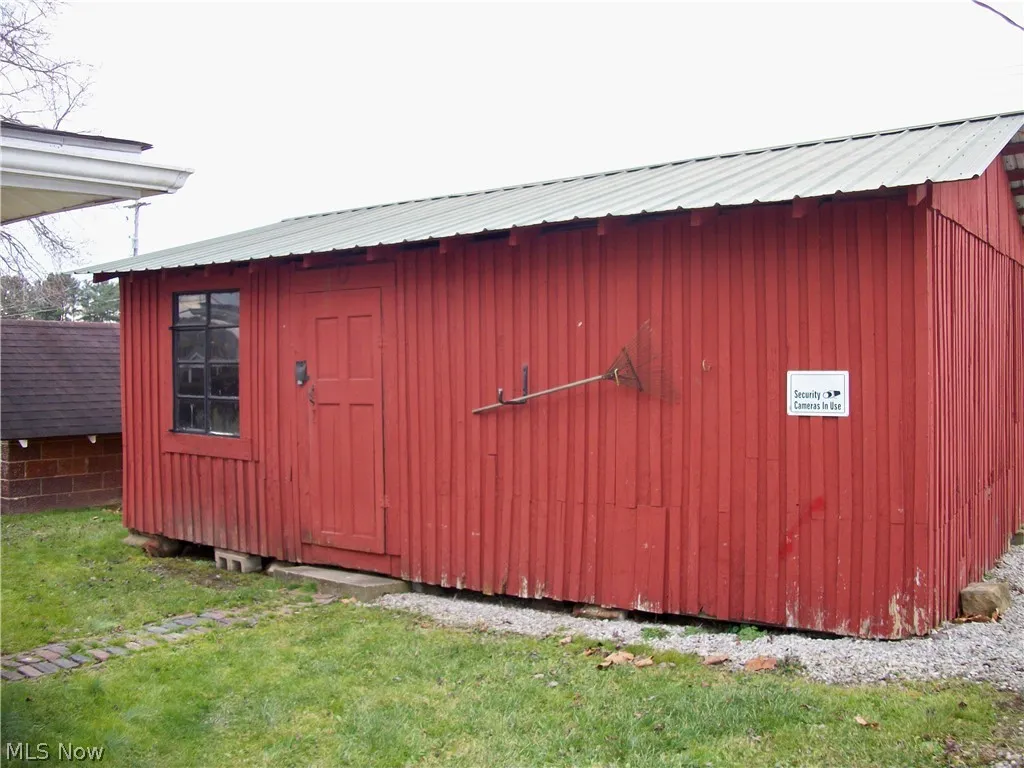 View of shed / structure with a lawn