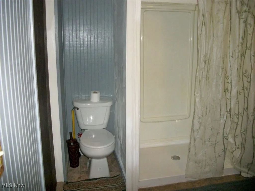 Second floor Bathroom featuring a shower and toilet