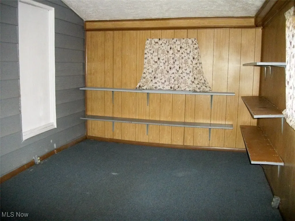 area off of the bathroom for added storage.