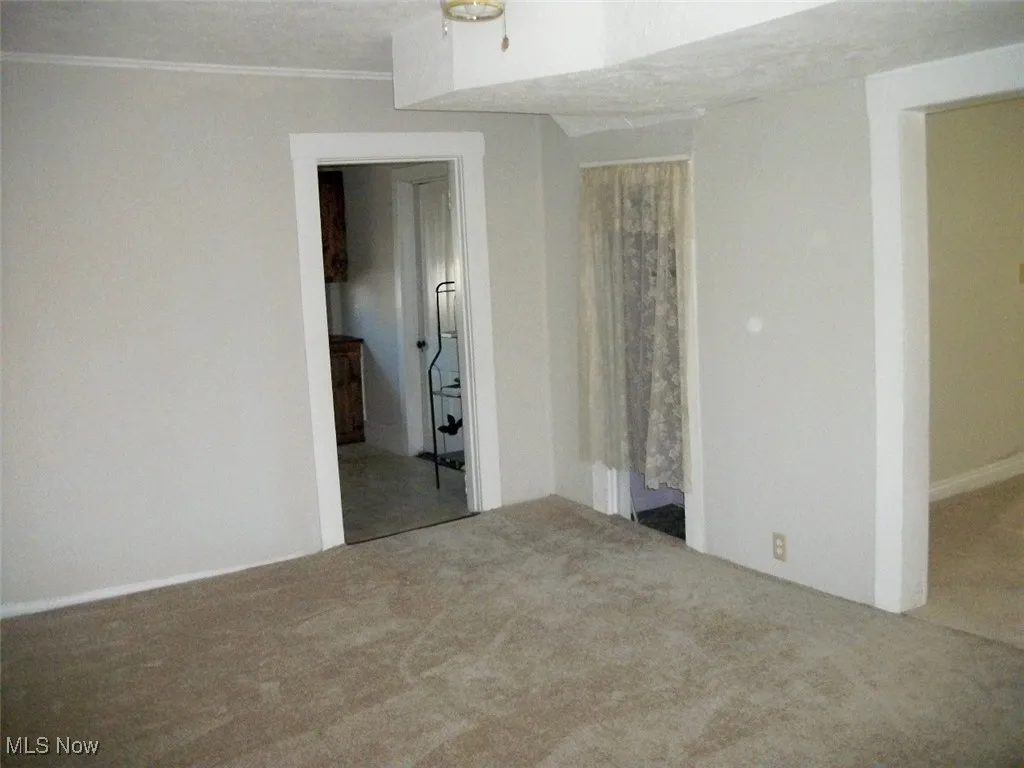 Dining Room Leading to the kitchen with neutral carpet. leading