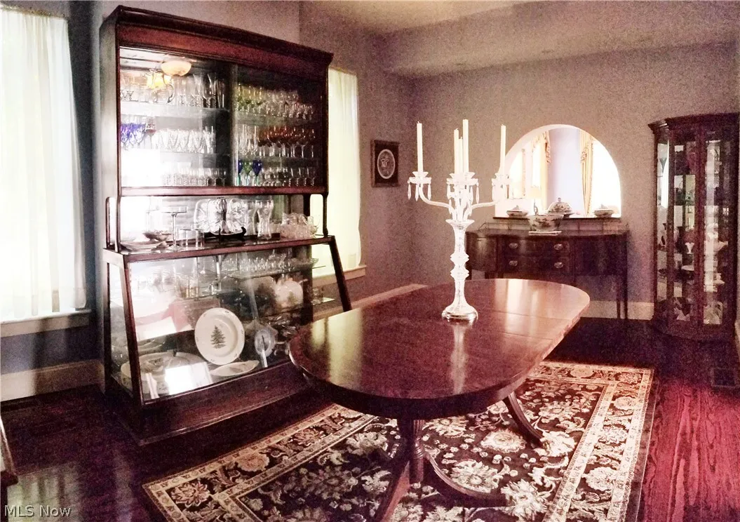 Bar with dark hardwood / wood-style flooring