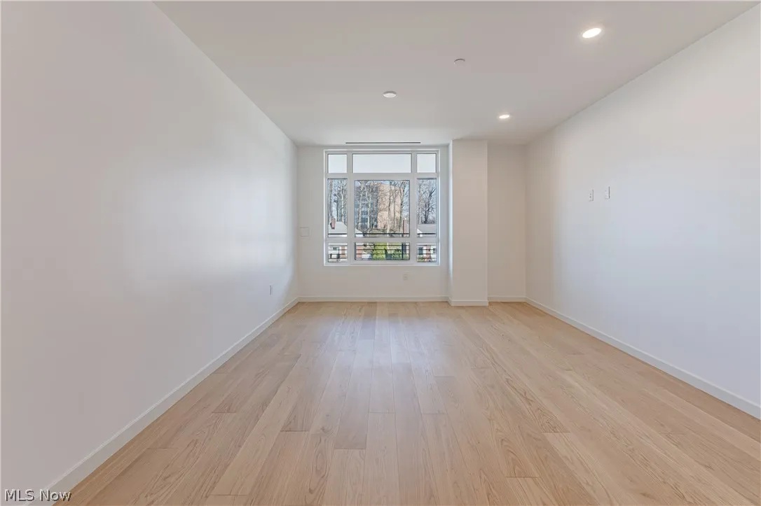 Unfurnished room with light hardwood / wood-style flooring