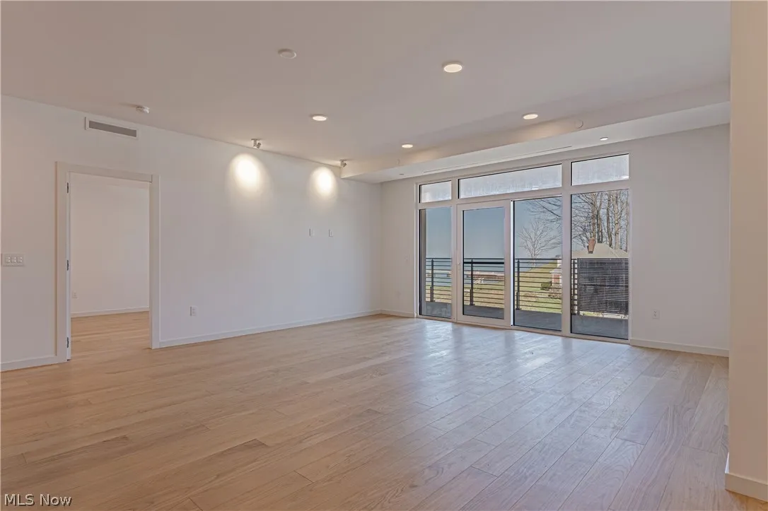Unfurnished room featuring light wood-type flooring