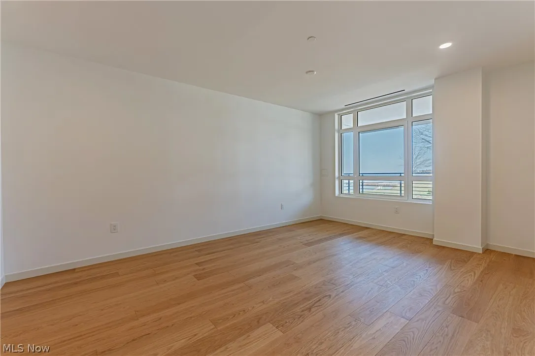 Unfurnished room with light hardwood / wood-style floors