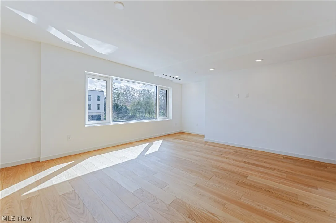 Unfurnished room with light hardwood / wood-style floors