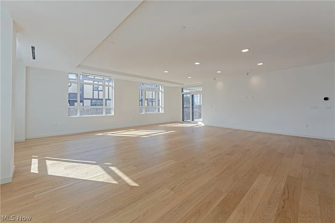 Unfurnished room with light hardwood / wood-style flooring