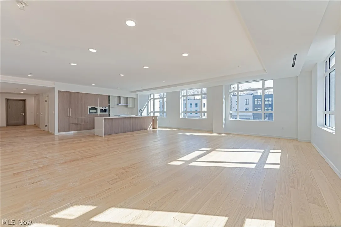 Unfurnished living room with light hardwood / wood-style flooring