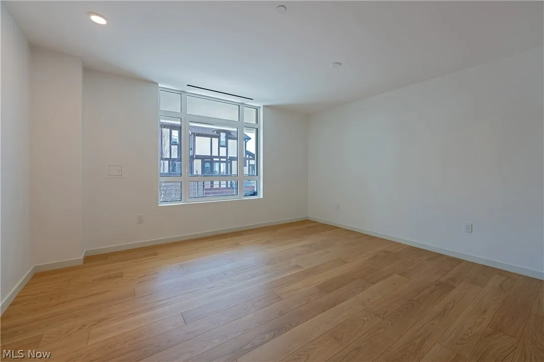 Empty room featuring light wood-type flooring